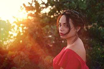 Woman in Red Dress Looking Back at Sunset