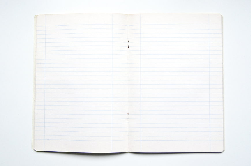 Open Vintage Lined Notebook on White Background
