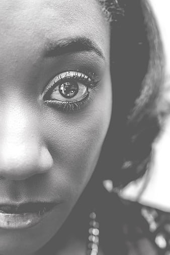 Close-up black and white portrait of a woman's eye