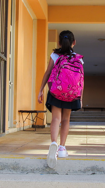 Young Girl Walking Away with Pink Backpack