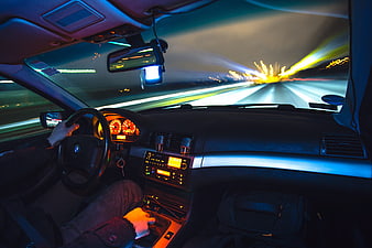 Night driving in a car with motion blur on the highway