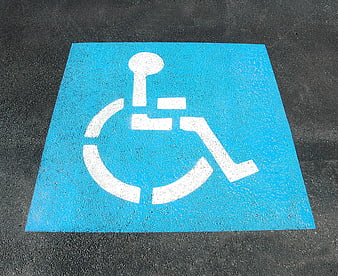 Blue Handicap Parking Symbol Painted on Asphalt