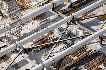 Aerial view of construction site with steel beams and scaffolding