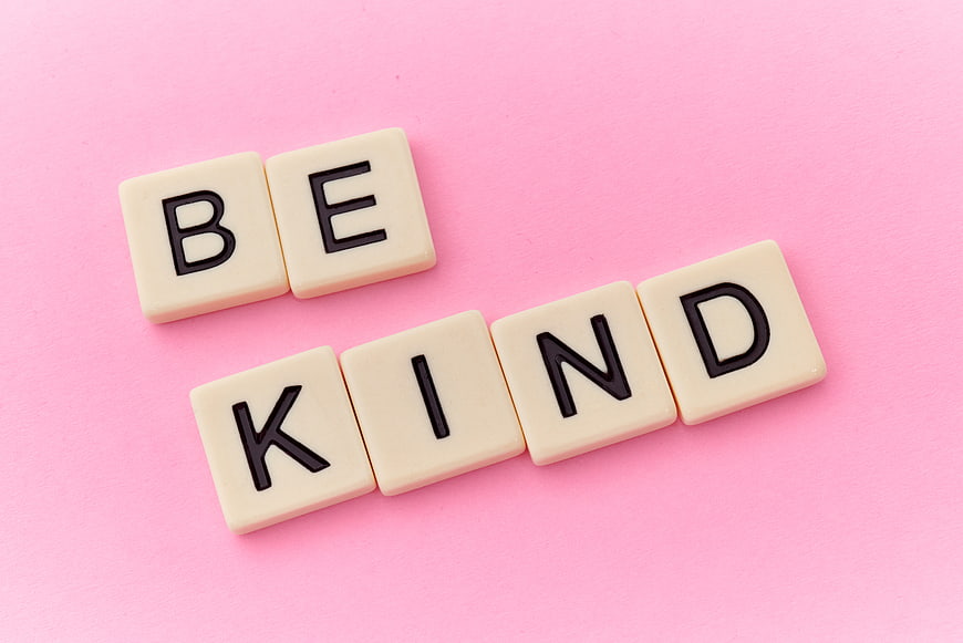 Be Kind Scrabble Tiles on Pink Background