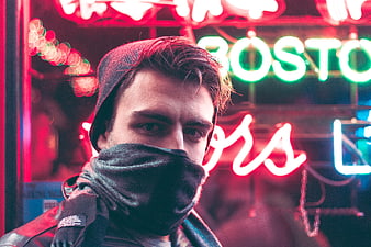 Man with Scarf in Front of Neon Lights