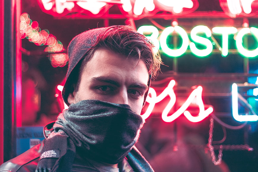 Man with Scarf in Front of Neon Lights