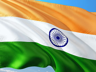 Waving Indian Flag Against Blue Sky
