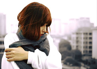 Melancholic Asian Woman in Scarf Looking Down