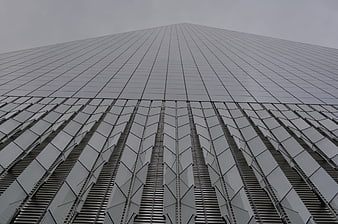 Low angle view of modern skyscraper facade with geometric patterns
