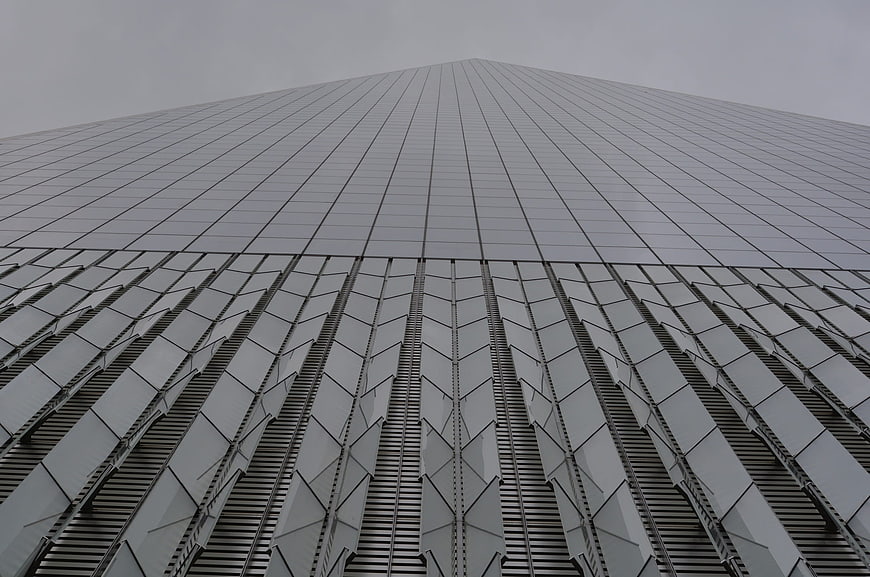 Low angle view of modern skyscraper facade with geometric patterns