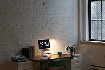 Modern Home Office Workspace with Laptop and Typewriter