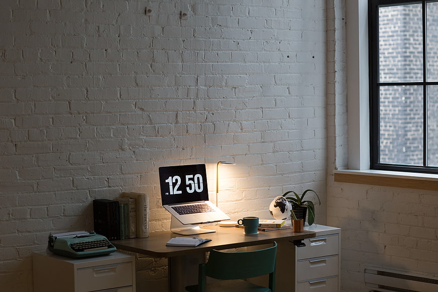 Modern Home Office Workspace with Laptop and Typewriter
