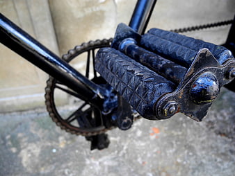 Close-up of vintage rusty bicycle pedal and chain