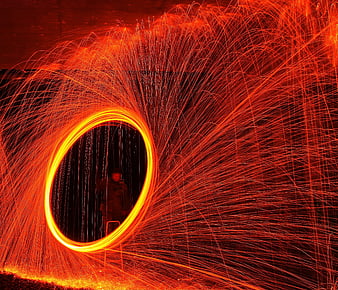 Steel wool spinning fire light painting at night