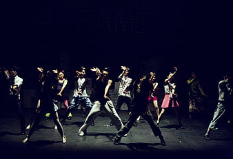 Contemporary Dance Performance on Dark Theater Stage