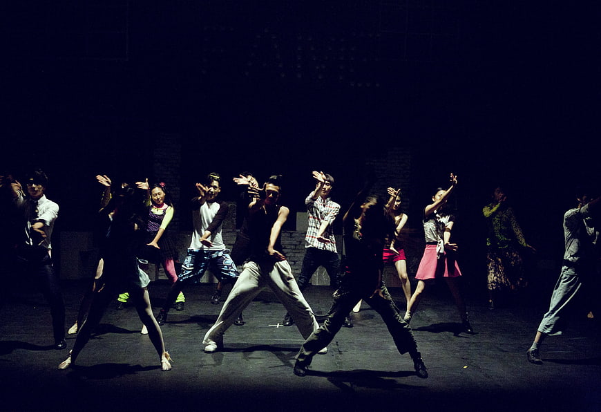 Contemporary Dance Performance on Dark Theater Stage