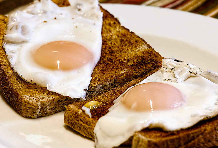 Fried eggs on toast close-up breakfast food photography