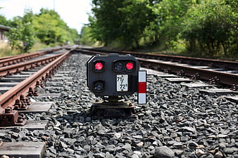 Railway Signal Light On Gravel Tracks