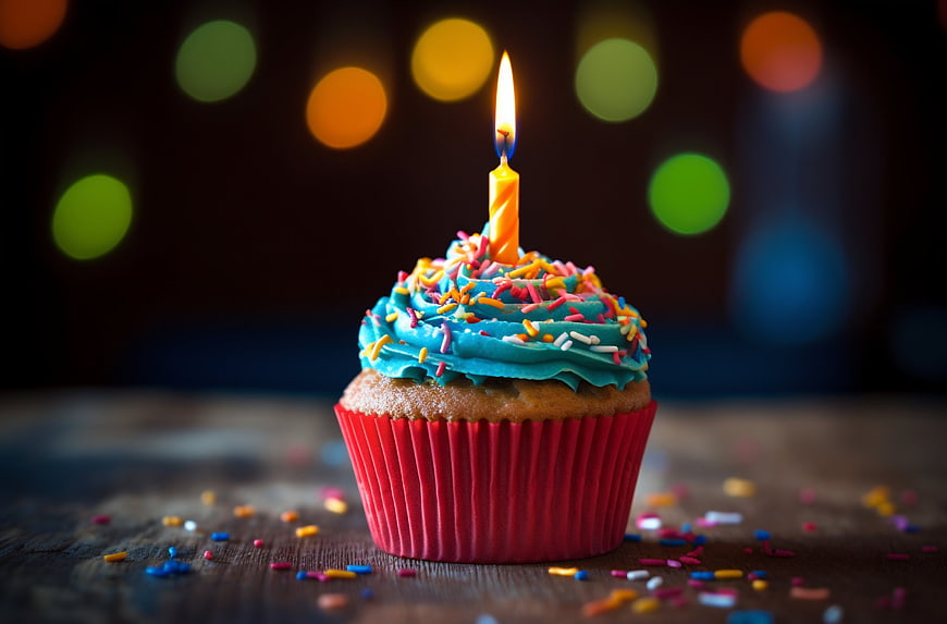 Colorful Birthday Cupcake with Candle and Sprinkles