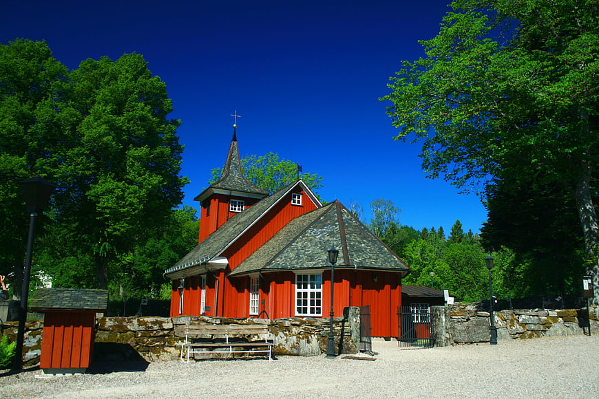 Red wooden church in Sweden with blue sky