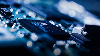 Close-up of computer circuit board with blue lighting