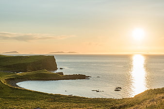Serene Coastal Landscape at Golden Hour with Cliffs and Ocean