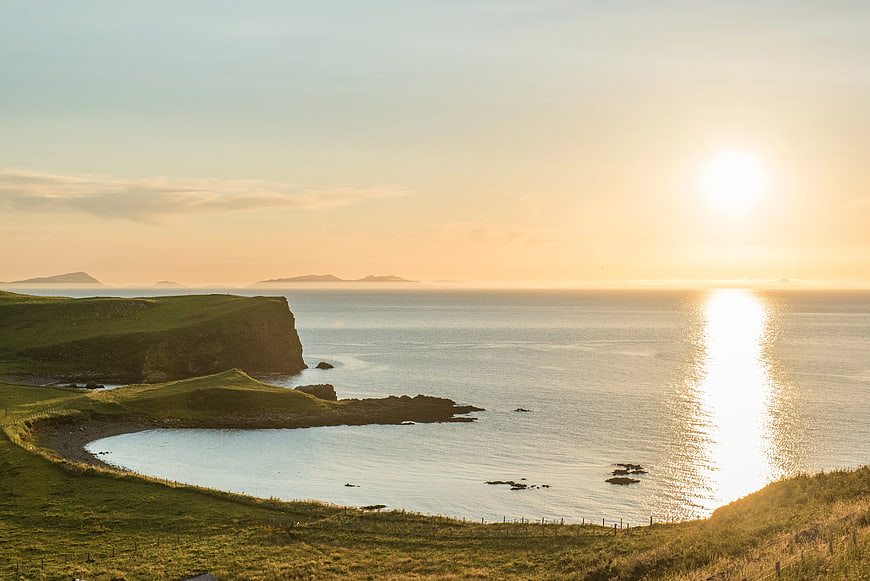 Serene Coastal Landscape at Golden Hour with Cliffs and Ocean