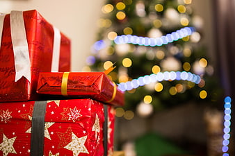 Red Christmas Gifts with Bokeh Tree Lights Background