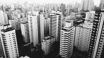 Black and white aerial view of dense urban cityscape