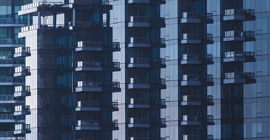 Modern Glass Apartment Building Facade with Balconies