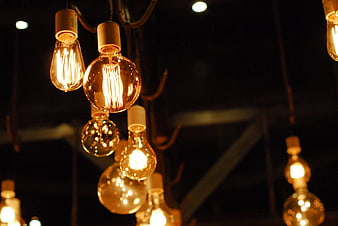 Vintage Edison Light Bulbs Hanging in Dark Room