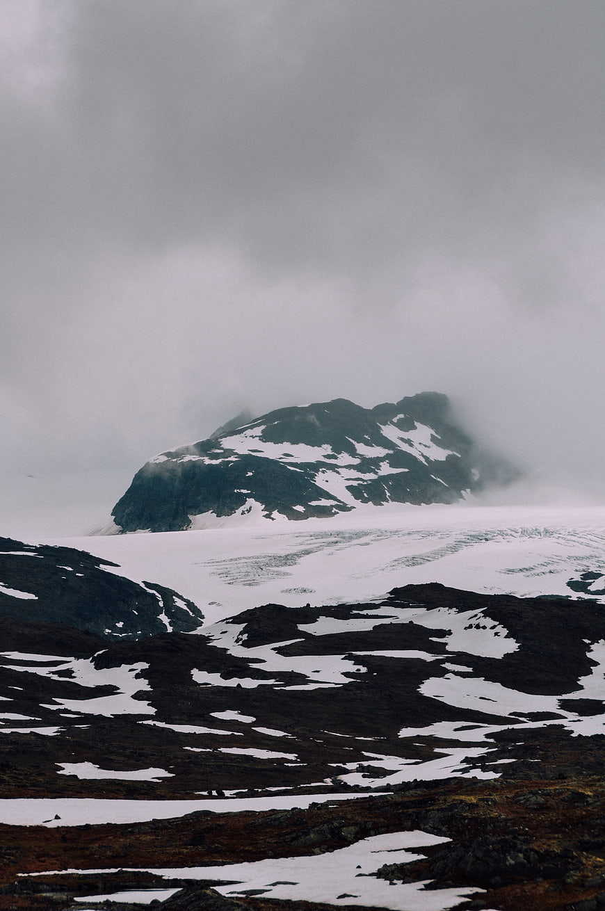 Misty Snow-Capped Mountain Peak in Winter Landscape
