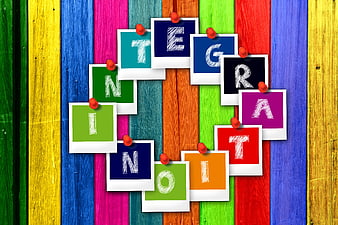 Integration concept with colorful polaroid photos on wooden background