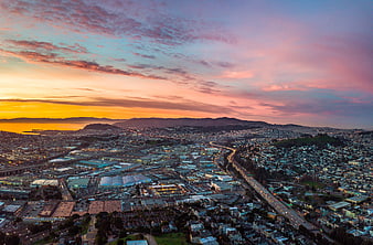 Aerial View of San Francisco Cityscape at Sunset with Golden Sky
