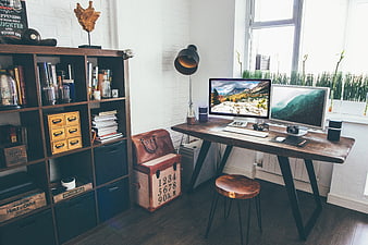 Modern rustic home office workspace with dual monitors