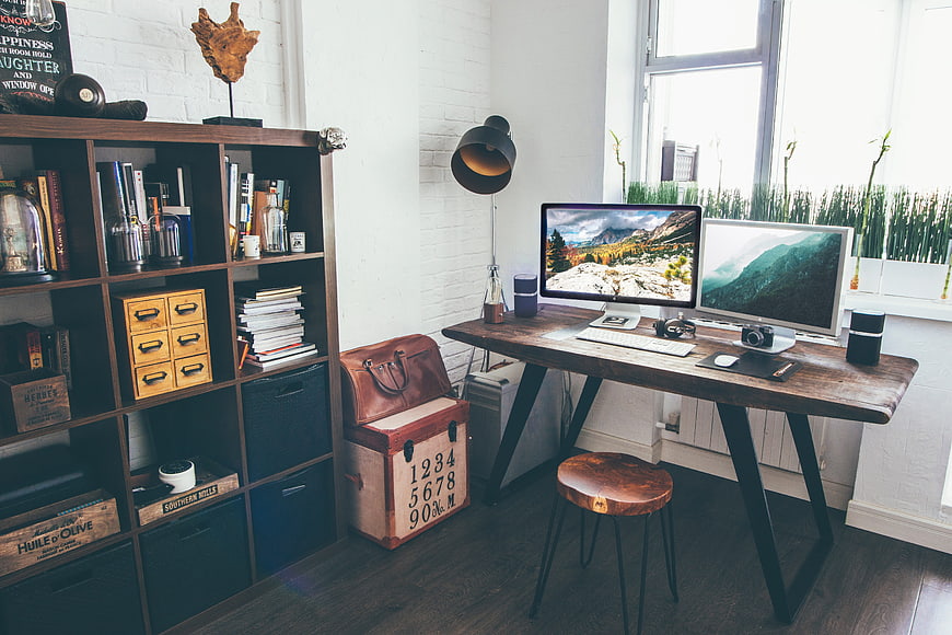 Modern rustic home office workspace with dual monitors