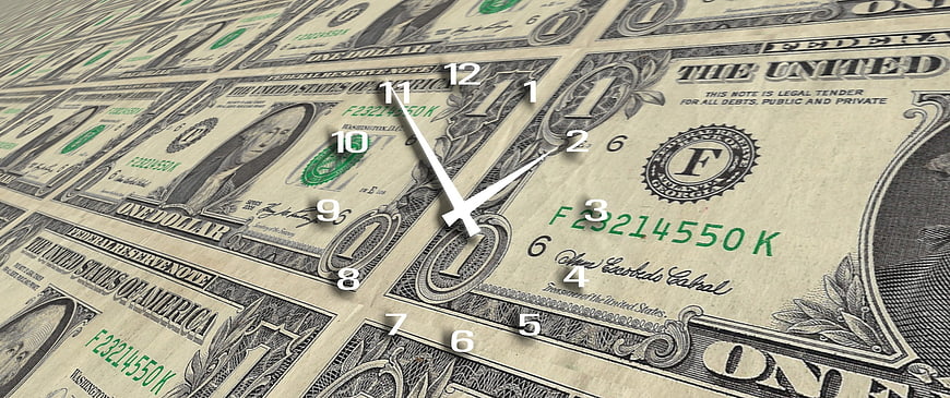Clock Face Superimposed On US Dollar Bills