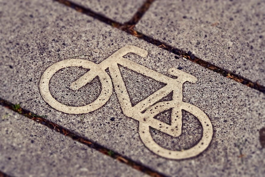 Bicycle Symbol Stenciled on Concrete Pavement