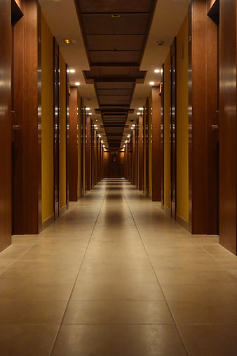 Long Wooden Hotel Corridor with Tiled Floor