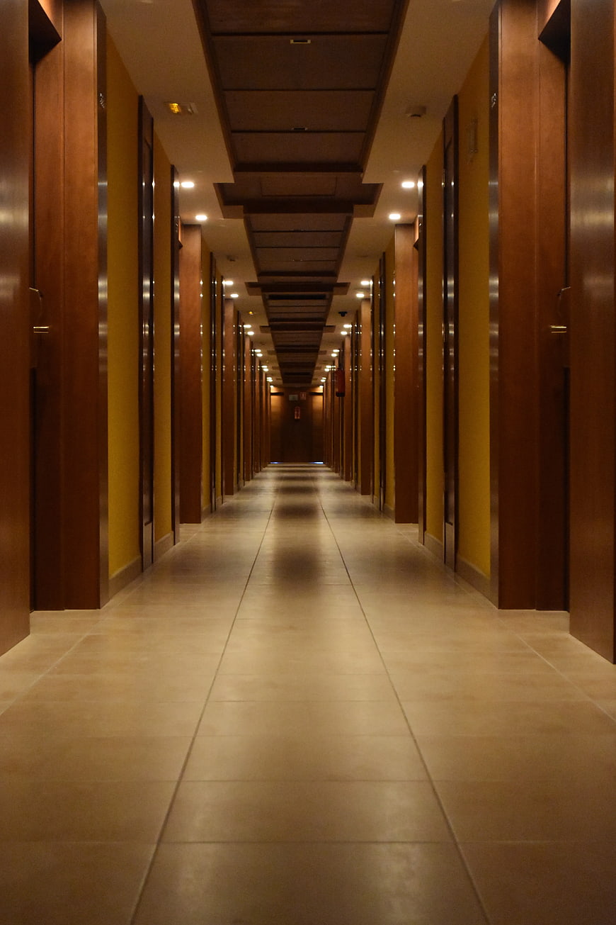 Long Wooden Hotel Corridor with Tiled Floor