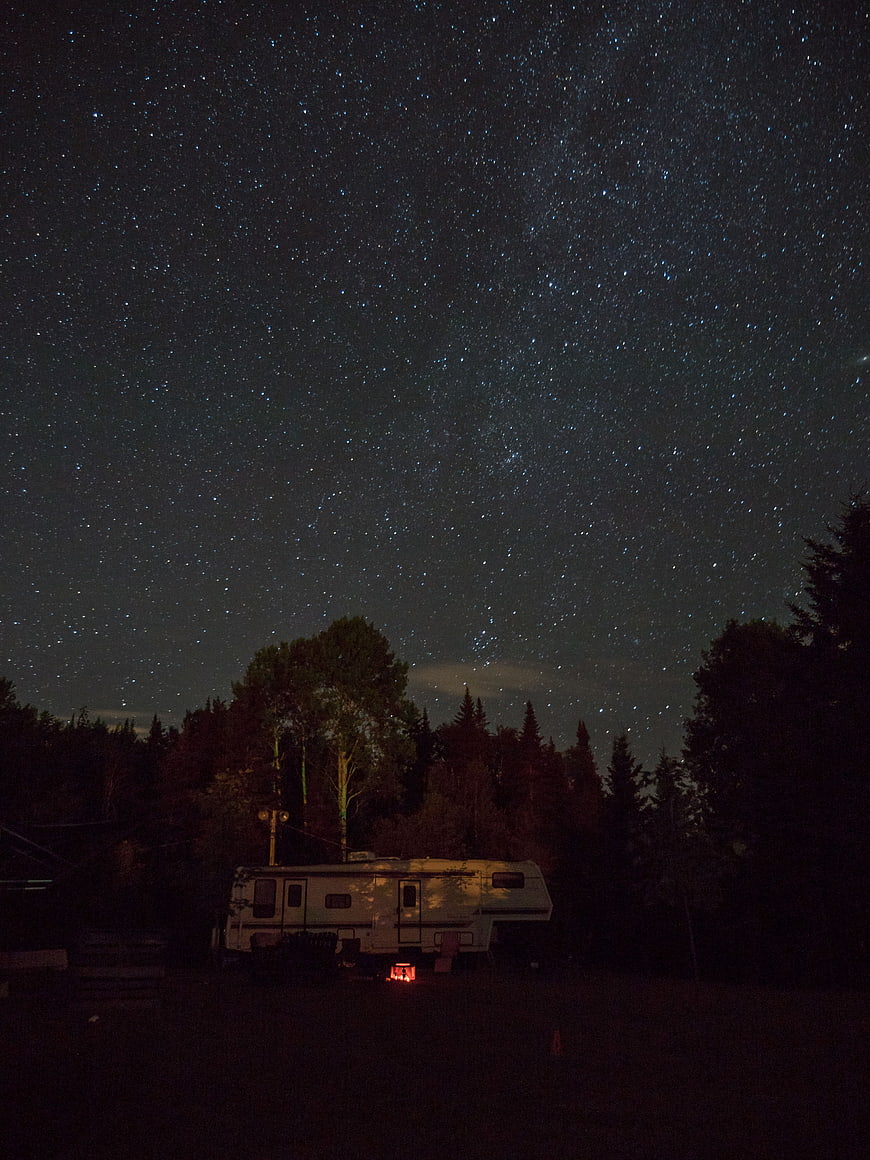 Night Sky with Stars Over RV Campsite in Forest