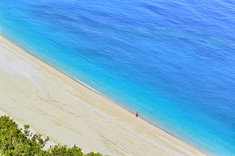 Aerial View of Turquoise Beach with Lone Walker