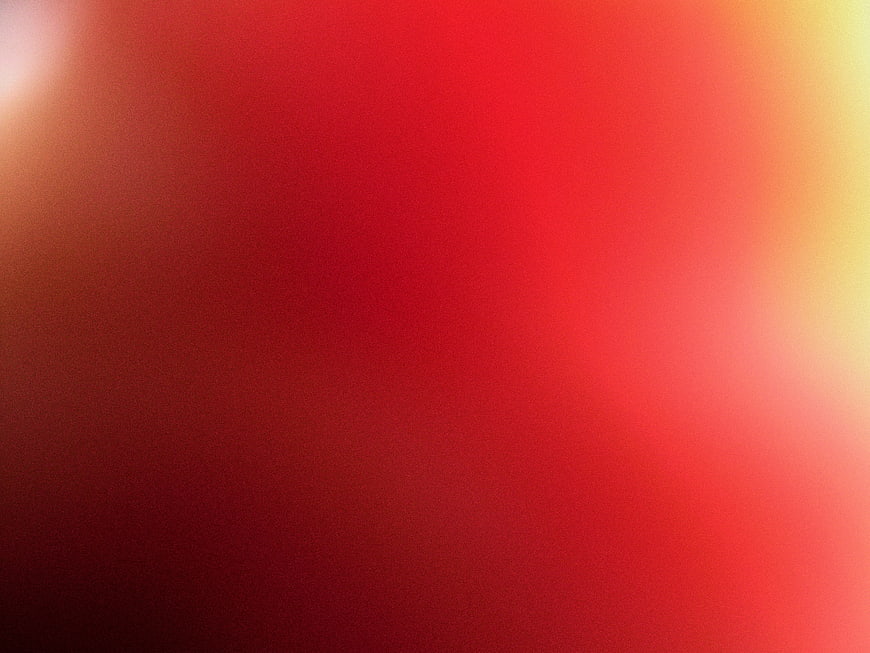 Abstract Red and Orange Gradient Background with Grainy Texture