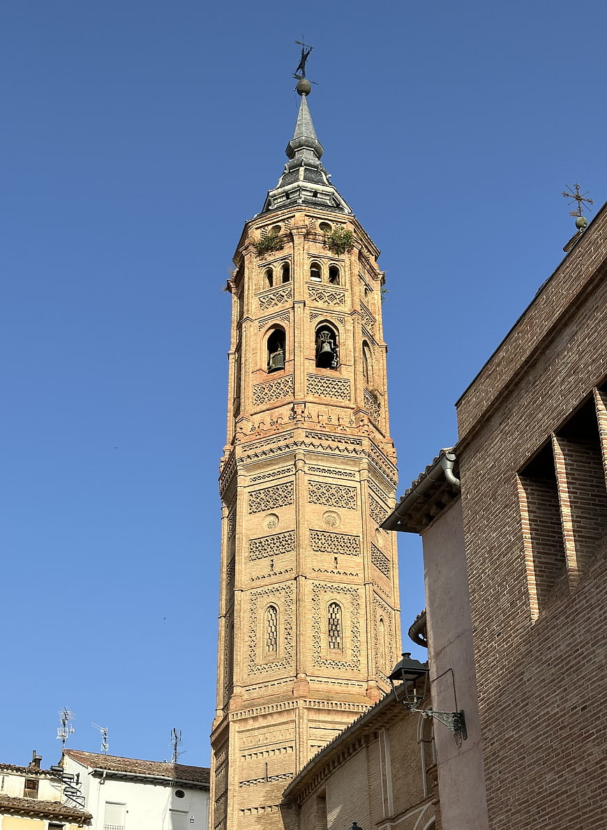 Historic Brick Bell Tower Against Blue Sky