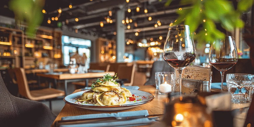 Gourmet Ravioli and Red Wine in Cozy Restaurant