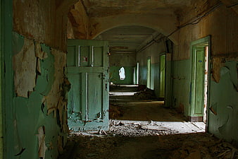 Abandoned Green Hospital Corridor with Peeling Paint