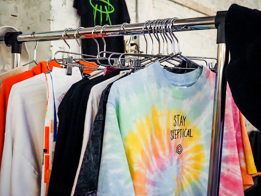 Colorful Tie-Dye Shirts on Metal Clothing Rack