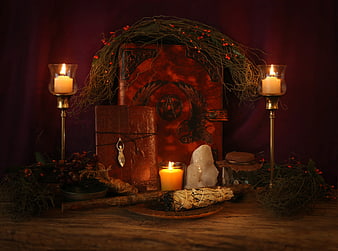 Pagan Ritual Altar With Candles, Crystals, And Wreath