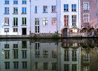 Colorful historic houses reflected in canal water