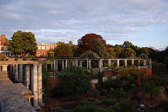 Classical colonnade and gardens at sunset in London